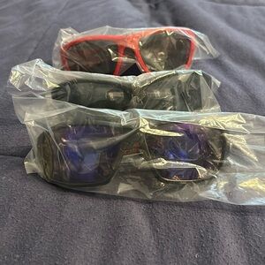 Brand new with tags set of three pairs of men’s sunglasses